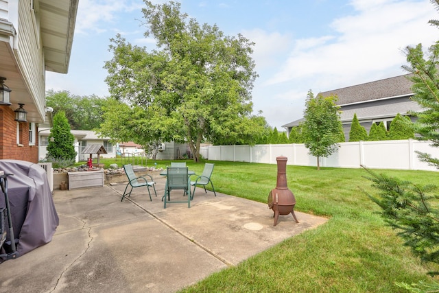 view of patio / terrace featuring outdoor dining space, area for grilling, and a fenced backyard