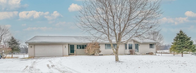 ranch-style house featuring a garage