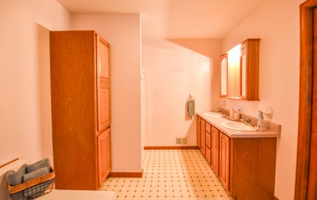 204 W Hatmaker Rd, Coldwater, MI 49036 - full bath with tile patterned floors and double vanity