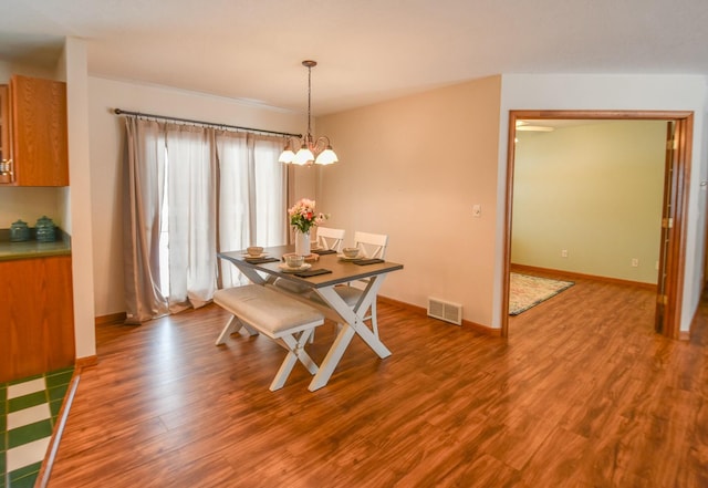 204 W Hatmaker Rd, Coldwater, MI 49036 - dining space with wood finished floors and a chandelier