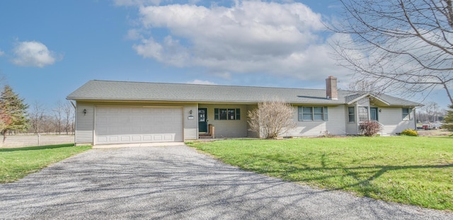 204 W Hatmaker Rd, Coldwater, MI 49036 - single story home featuring a garage, driveway, a front yard, and a chimney