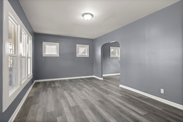 unfurnished room with hardwood / wood-style flooring