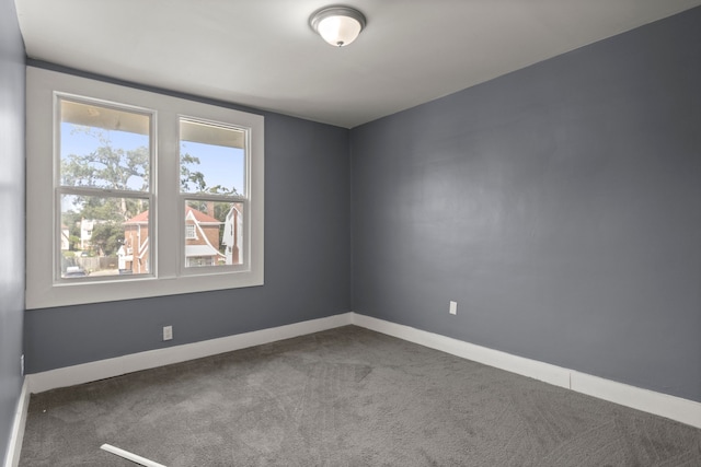 unfurnished room featuring carpet floors