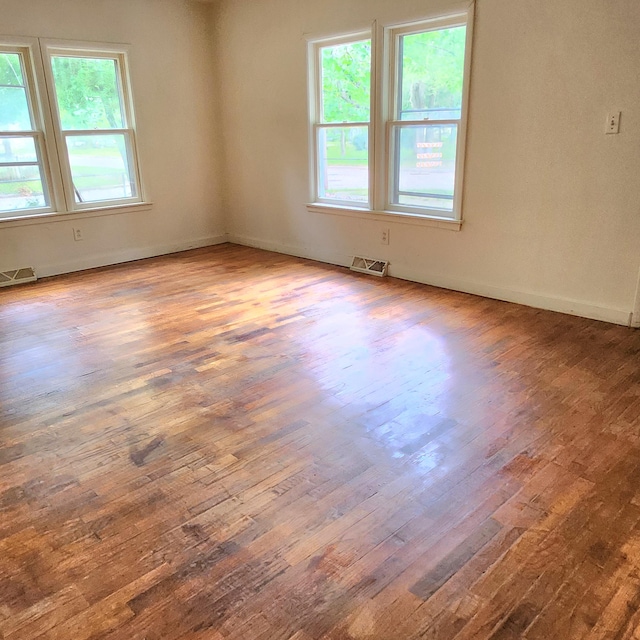 empty room with wood-type flooring