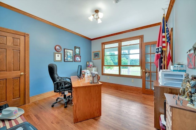 home office featuring light hardwood / wood-style floors and crown molding