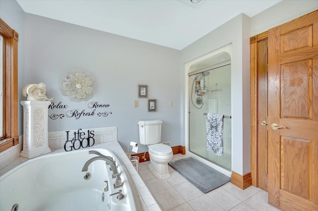 bathroom with tile patterned floors, toilet, and shower with separate bathtub