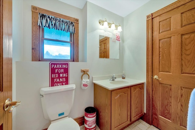 bathroom with vanity and toilet