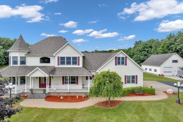 view of front of home with covered porch and a front lawn