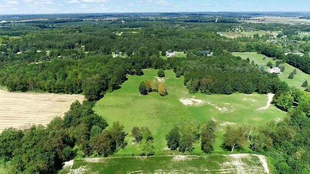 birds eye view of property featuring a rural view