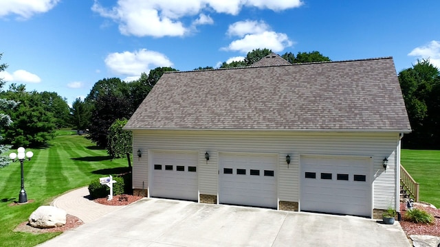 garage featuring a yard