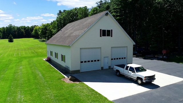 garage with a lawn