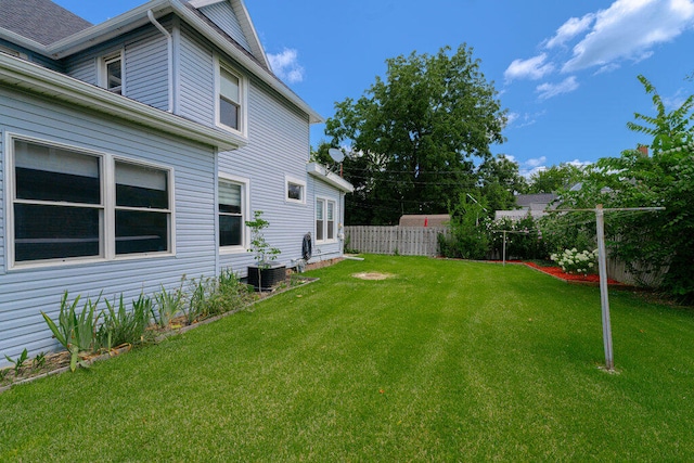 view of yard with central air condition unit