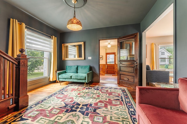 living area featuring a healthy amount of sunlight and light hardwood / wood-style floors