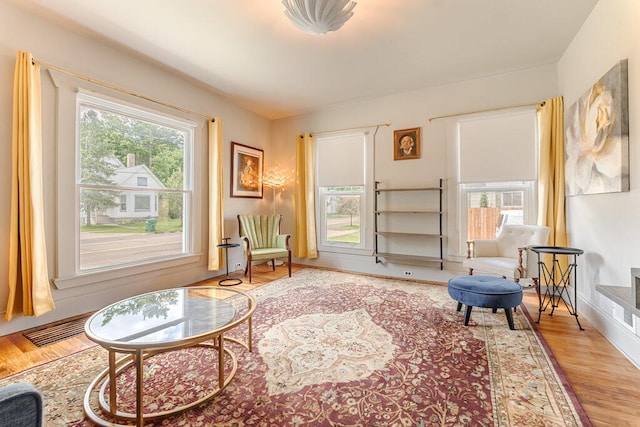 sitting room with light hardwood / wood-style floors