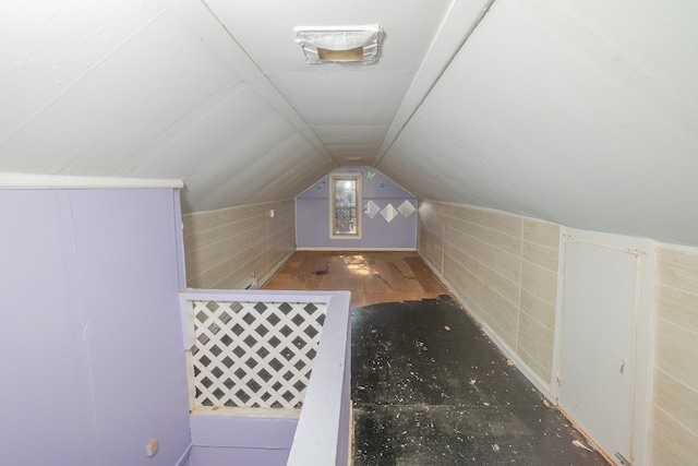 bonus room with lofted ceiling and hardwood / wood-style flooring