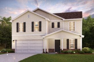 view of front of property with a yard and a garage