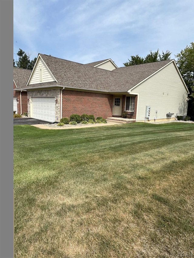 ranch-style home with a garage and a front yard