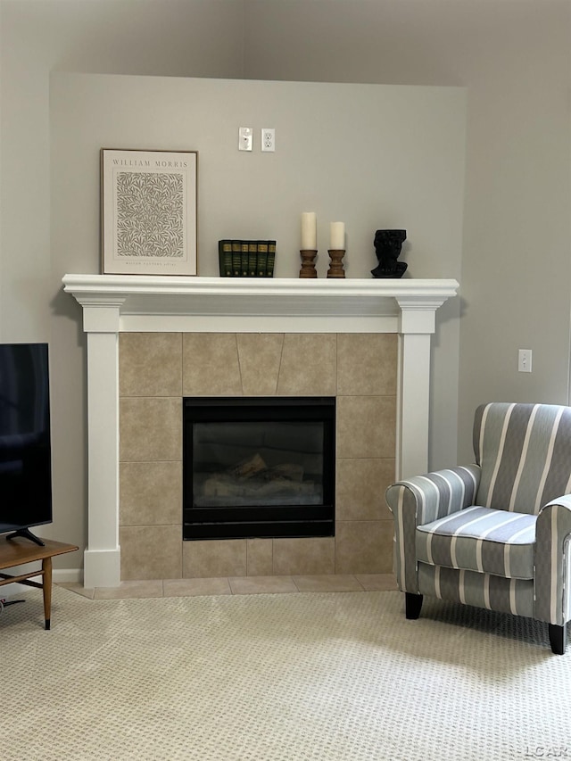 sitting room with a fireplace