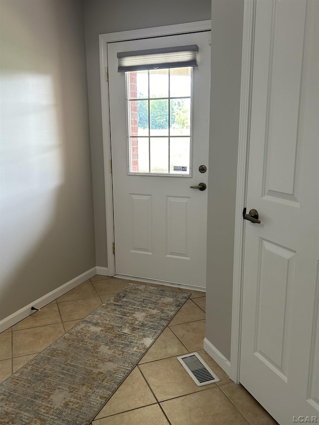 doorway featuring light tile patterned floors