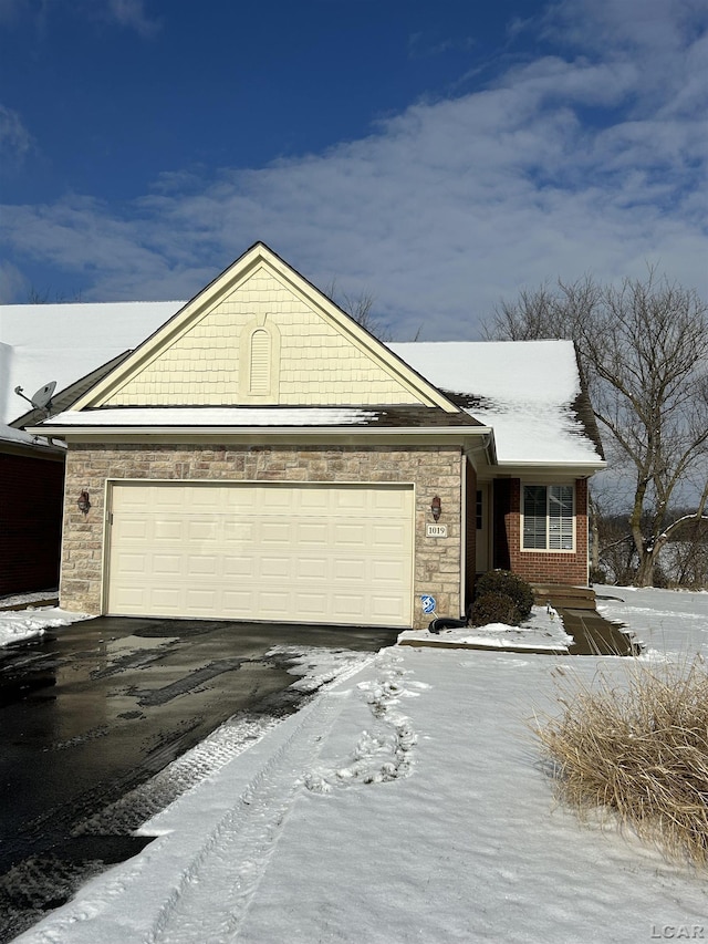 single story home with a garage