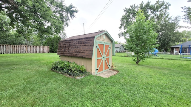 view of outdoor structure featuring a lawn