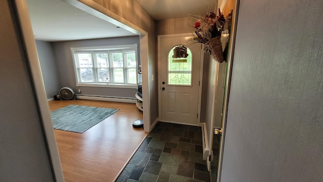 doorway featuring dark hardwood / wood-style floors and a baseboard radiator