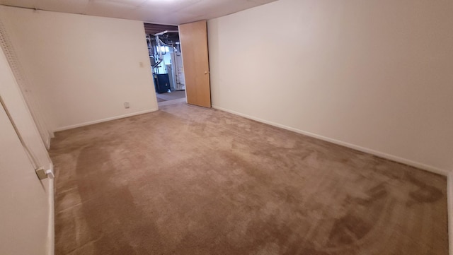 unfurnished room featuring carpet