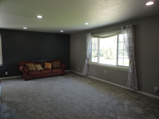 unfurnished living room featuring carpet