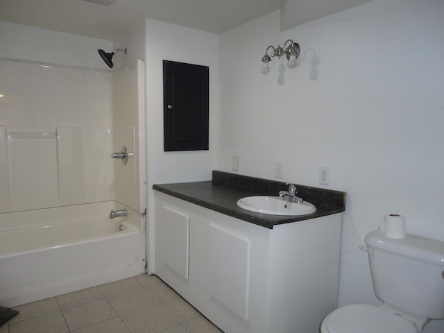 full bathroom featuring toilet, vanity, tile patterned floors, and tub / shower combination