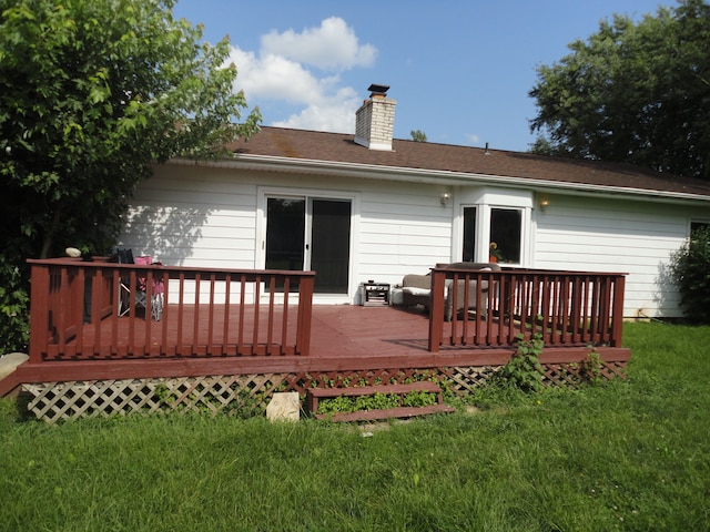 wooden deck with a lawn