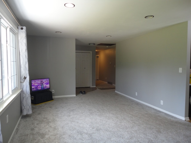 carpeted empty room featuring a healthy amount of sunlight