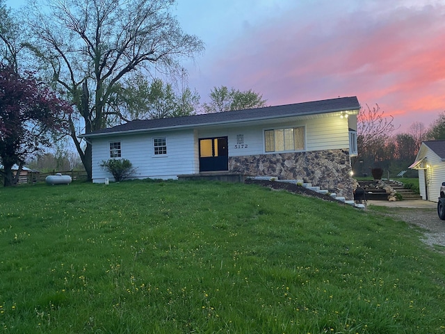 view of front of home with a lawn