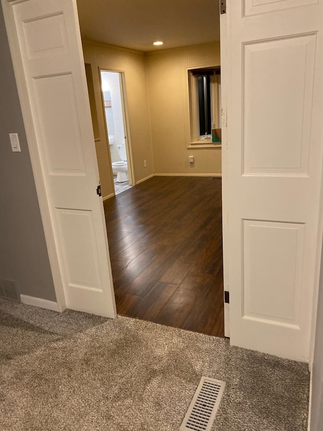 unfurnished room featuring dark hardwood / wood-style floors