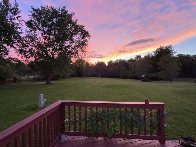 deck at dusk with a lawn