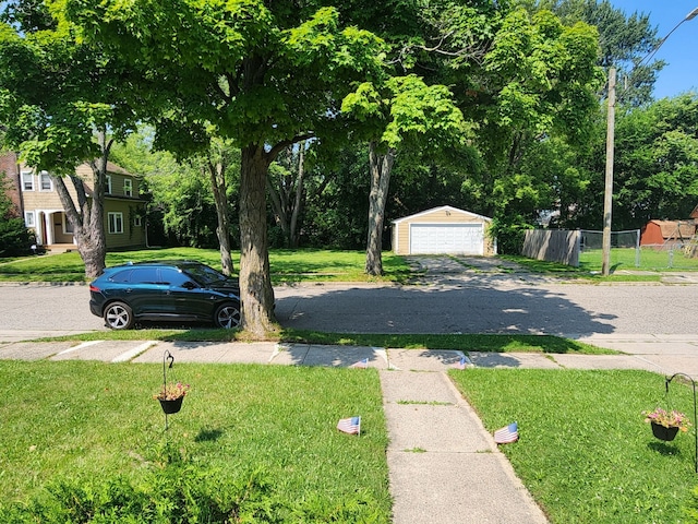 view of yard with an outbuilding and a garage