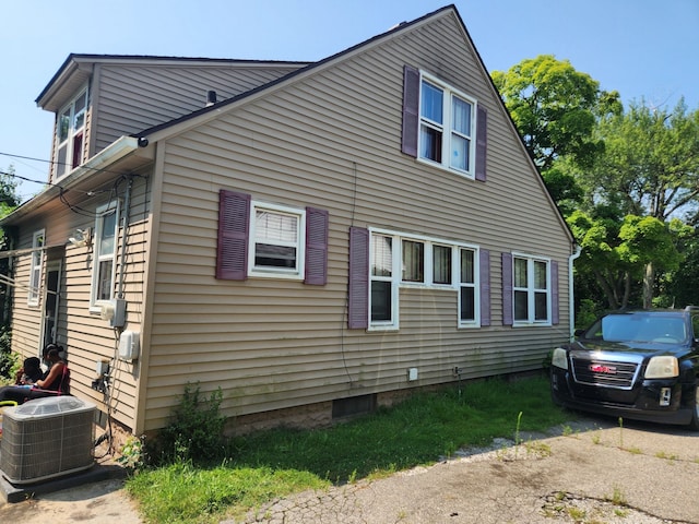 view of side of home featuring central air condition unit