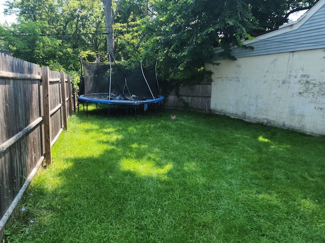 view of yard with a trampoline