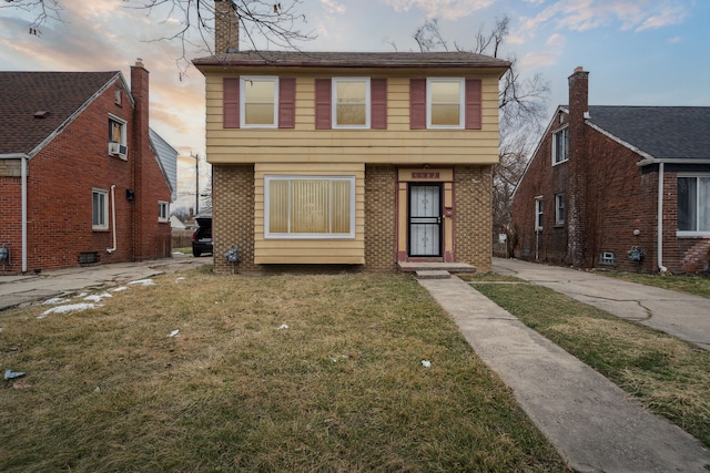 view of front of house with a yard