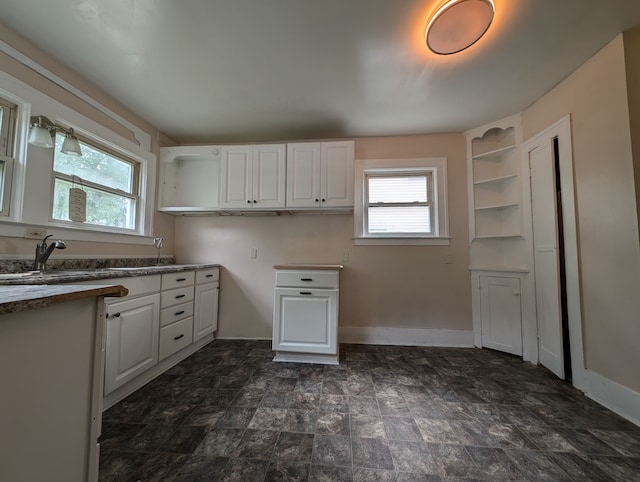 kitchen with white cabinets and sink