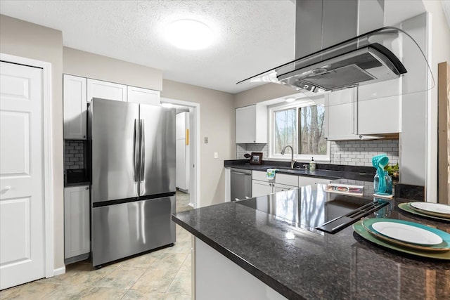 kitchen featuring tasteful backsplash, a textured ceiling, stainless steel appliances, sink, and white cabinetry