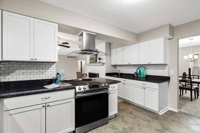 kitchen with stainless steel range with electric cooktop, white cabinets, ceiling fan, tasteful backsplash, and island range hood