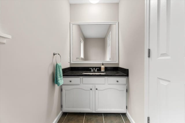 bathroom with tile patterned flooring and vanity