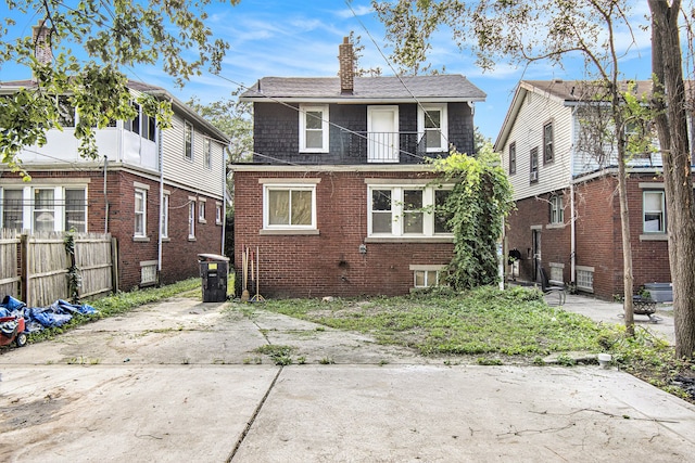 15766 Snowden St, Detroit, MI 48227 - back of property with a chimney and brick siding