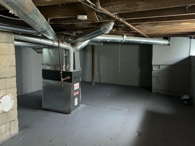 basement featuring heating unit