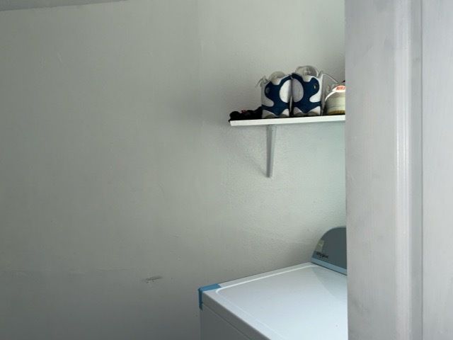 washroom with washer / clothes dryer