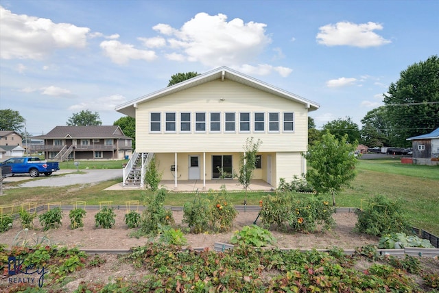 6800 Lakeshore Dr, Newport, MI 48166 - view of front of property featuring a patio, a front yard, and stairway