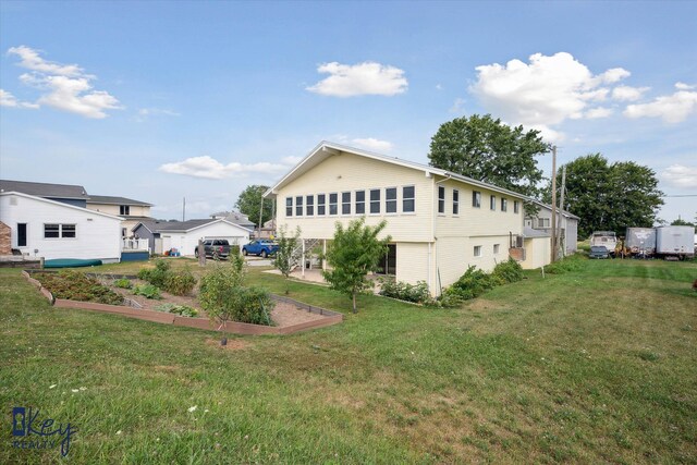 6800 Lakeshore Dr, Newport, MI 48166 - view of side of home with a vegetable garden and a lawn