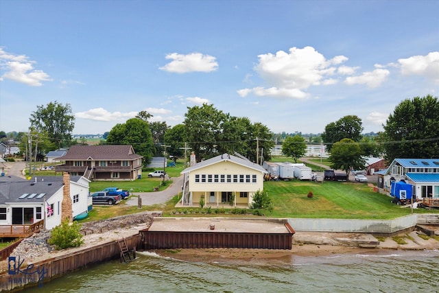 back of property with a water view