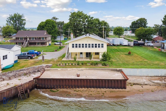 6800 Lakeshore Dr, Newport, MI 48166 - rear view of house with stairway, a lawn, and a deck with water view