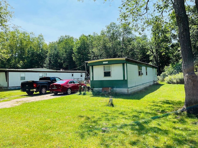 view of home's exterior featuring a lawn